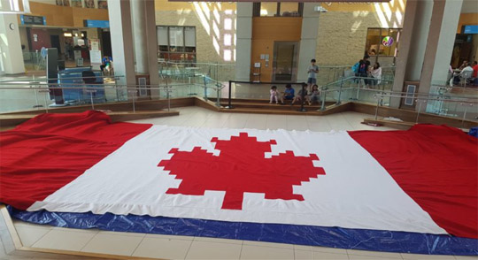 A Tribute to Canada  By Minu Bhatia. crocheted a 20 x 40 foot Canadian Flag